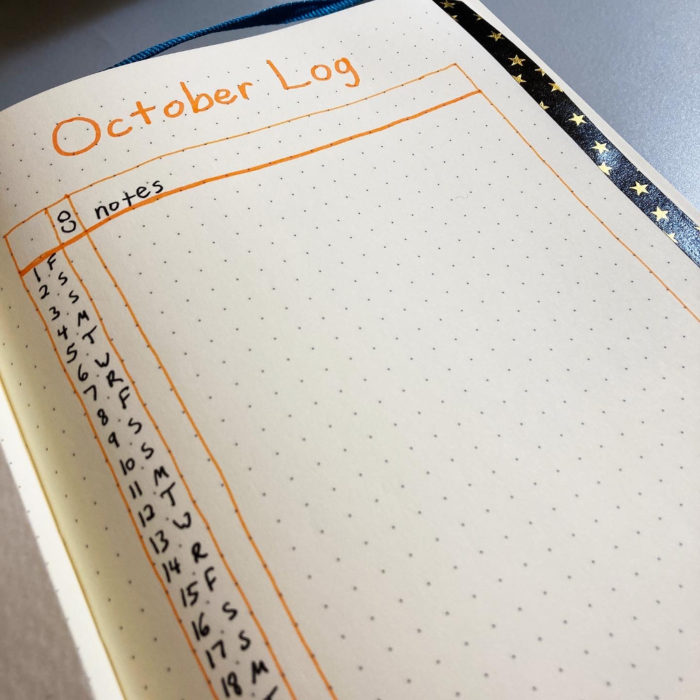 Close up of journal page with a monthly log for October