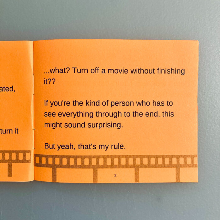 The second page of "My 20-minute rule for movies" zine. The text is printed in black on orange paper. A film strip runs along the bottom of the page. The text reads, "...what? Turn off a movie without finishing it?? If you're the kind of person who has to see everything through to the end, this might sound surprising. But yeah, that's my rule."