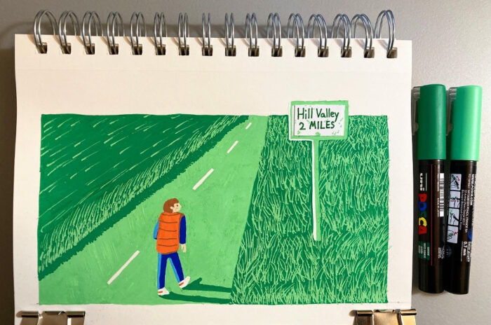 A painted illustration of Marty McFly walking into Hill Valley. The road is painted light green. The grassy fields on either side of the road are dark green and light green.A sign posted in the grass says "Hill Valley, 2 miles."